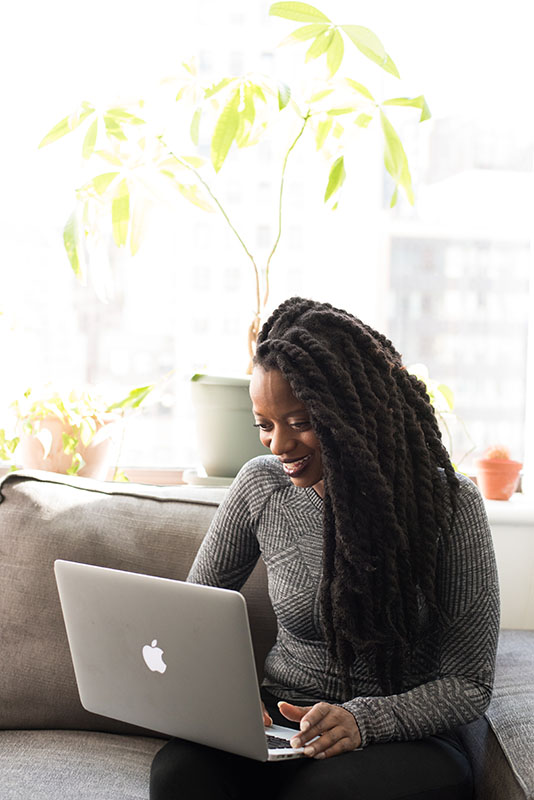 woman looking at laptop